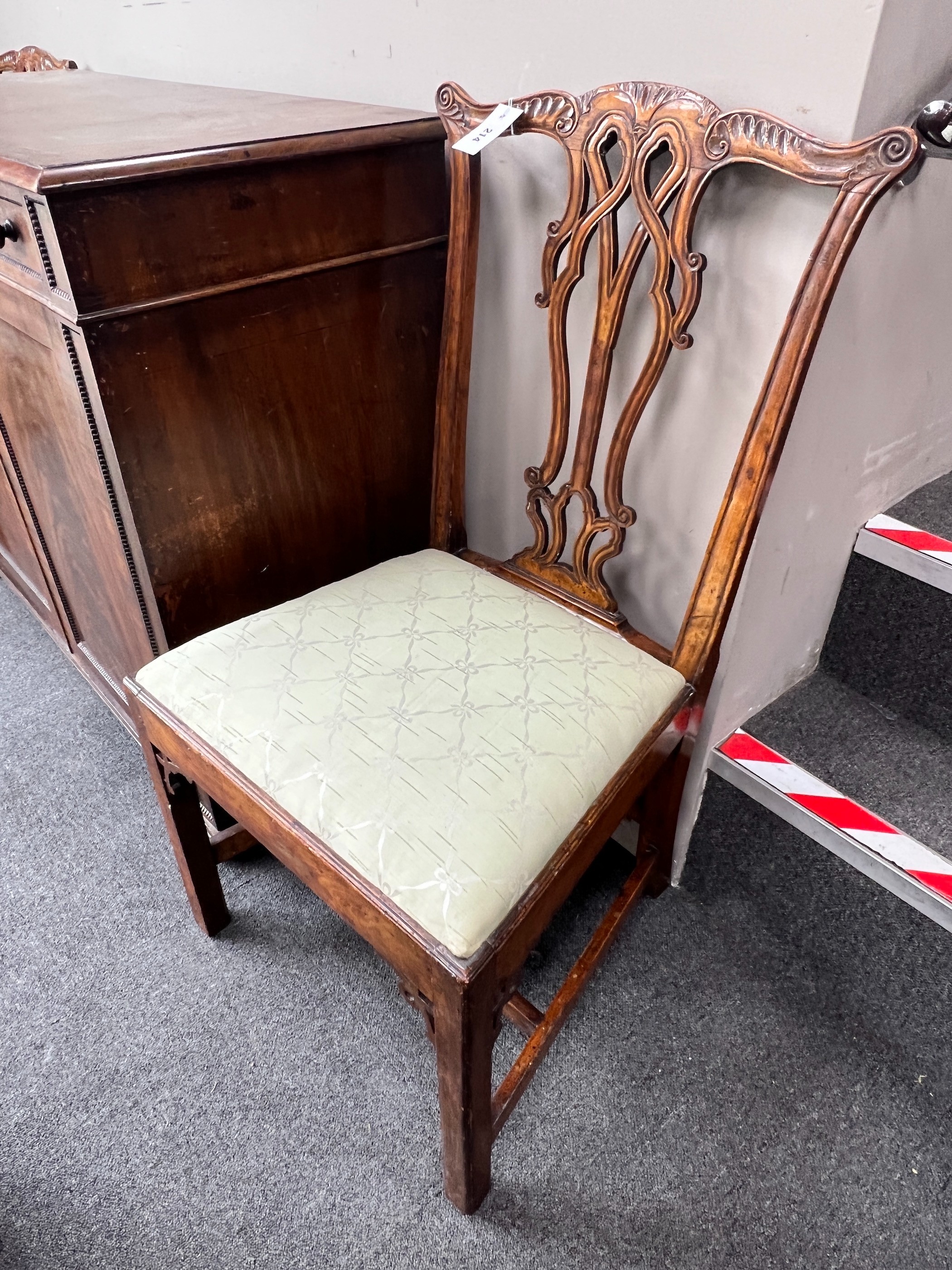 A pair of George III carved mahogany dining chairs